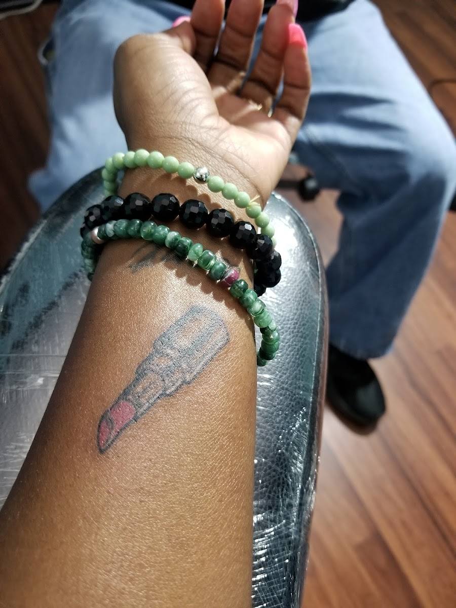Script tattoo on an inner wrist